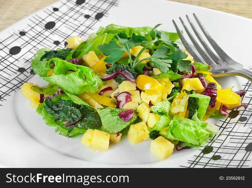 Vegetable salad with cheese on plate