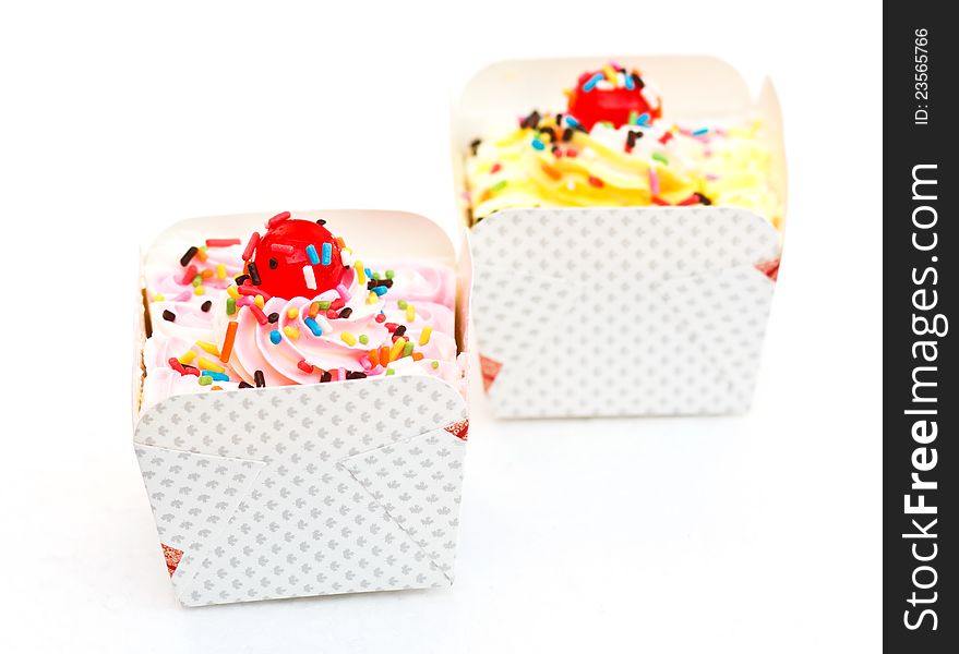 Sweets cupcakes are refreshments on white background. Sweets cupcakes are refreshments on white background