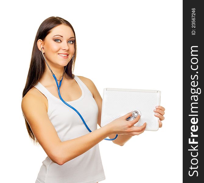 The young woman test the laptop with a tonometer on a white background