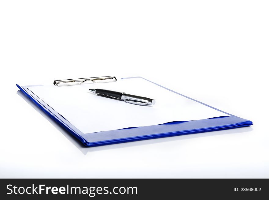 A pen on a blue pad folder. A pen on a blue pad folder
