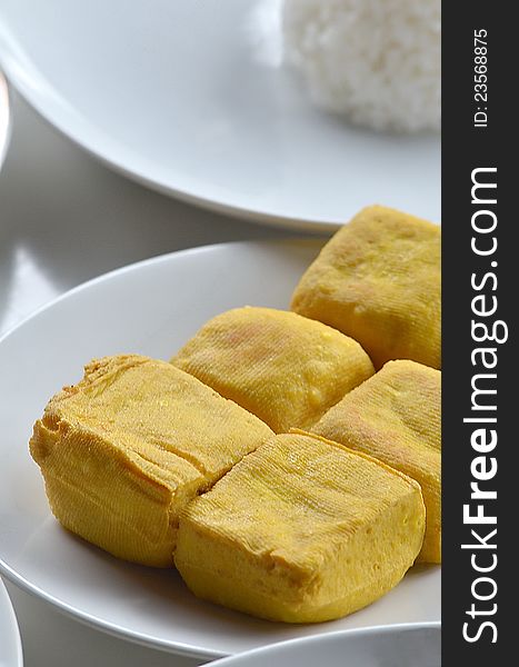 Fried tofu (soybean curd) usually served as additional food to complete the main menu in many tropical and asian traditional food. Fried tofu (soybean curd) usually served as additional food to complete the main menu in many tropical and asian traditional food