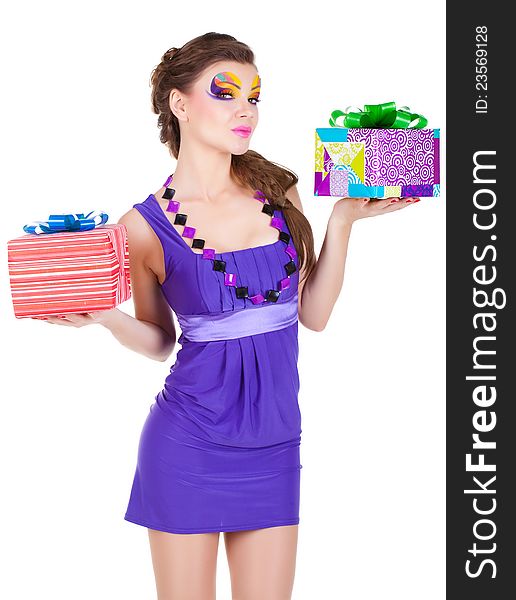 Beautiful woman with make up in dress with a gift