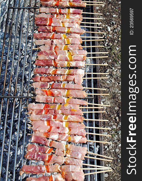 Raw pork kabobs grill on skewers