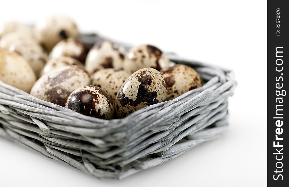 Quail eggs into the wicker basket