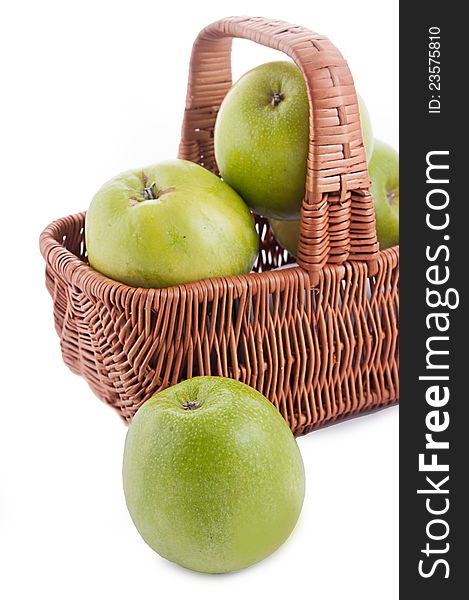 Ripe green apples in basket