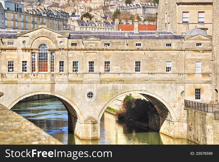 Great example of Georgian architecture, the landmark Pulteney Bridge spans the River Avon. Completed in 1773 it is only one of four bridges in the world with shops across the full span either side. Great example of Georgian architecture, the landmark Pulteney Bridge spans the River Avon. Completed in 1773 it is only one of four bridges in the world with shops across the full span either side.