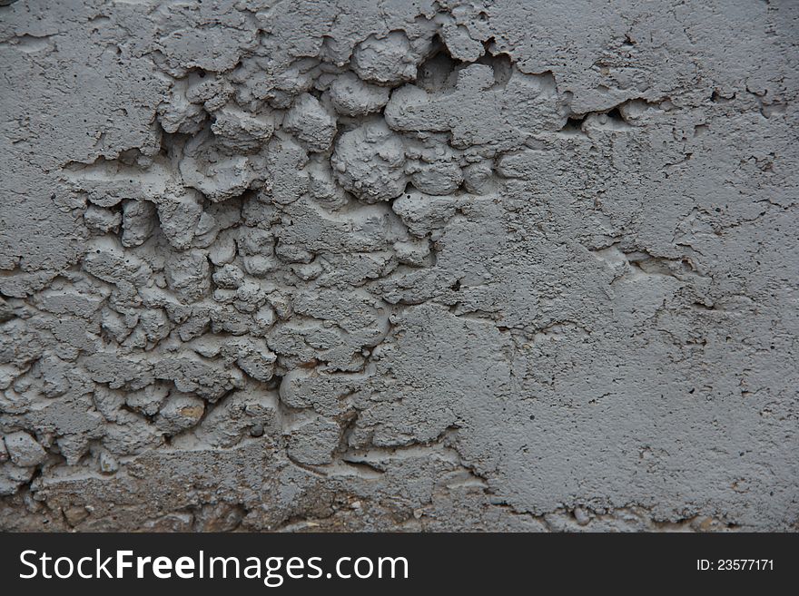 A close-up of a weathered concrete wall. A close-up of a weathered concrete wall.