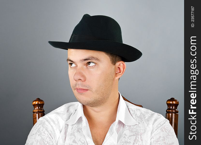 Portrait of young man in a hat