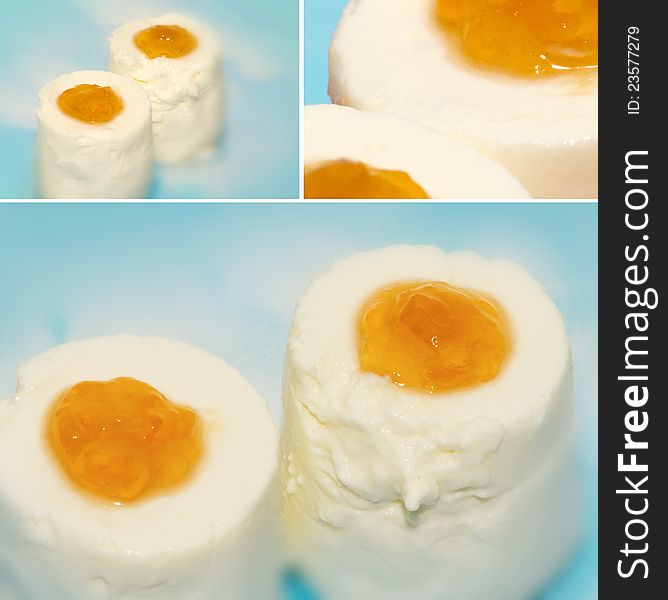 Yogurt with touch of apricot jam on blue background