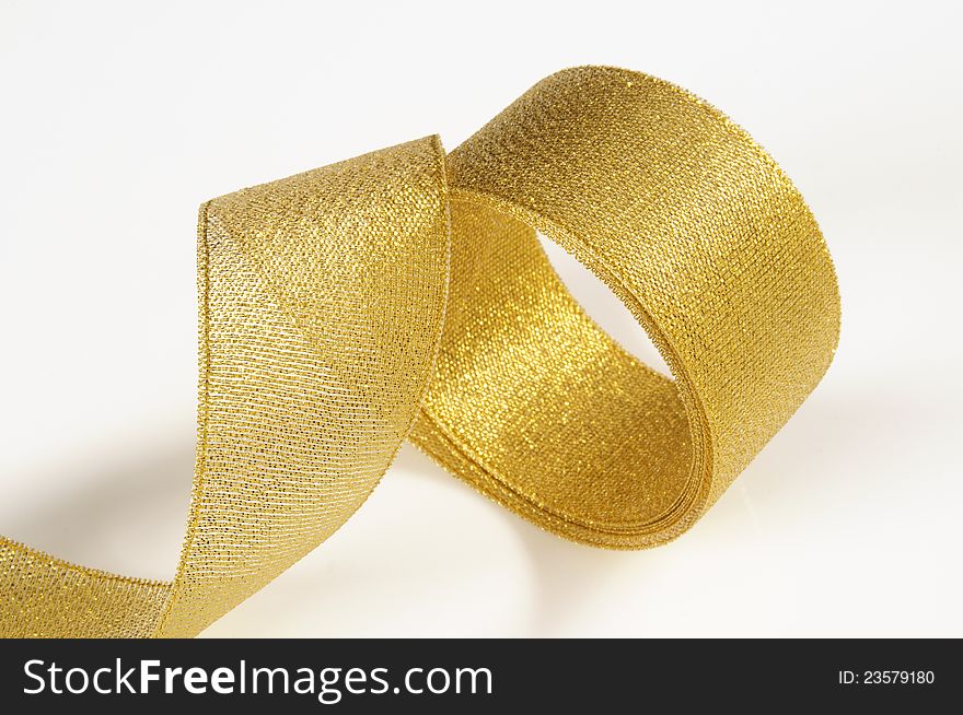 Golden gift band in spiral shape. Golden gift band in spiral shape.