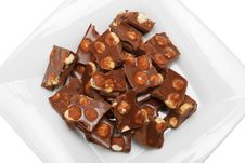 Broken Chocolate Pieces With Nuts On Plate Stock Photos Broken Chocolate Pieces With Nuts On Plate Stock Photos