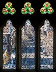 Three Tall Windows And Stained Glass Stock Images