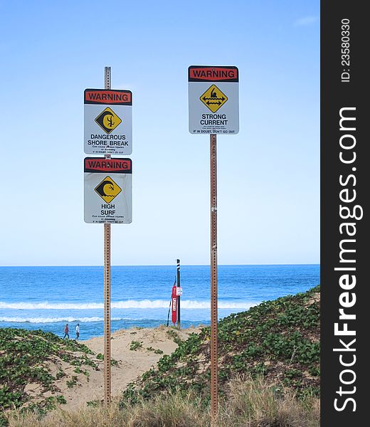 Sign is warning of dangerous shore break