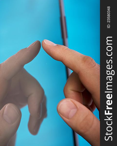Close-up on man`s finger touching screen. Close-up on man`s finger touching screen