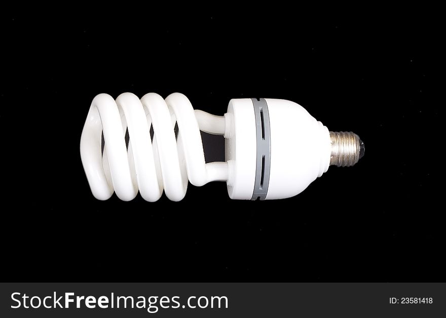 Energy-saving lamp isolated on black bac