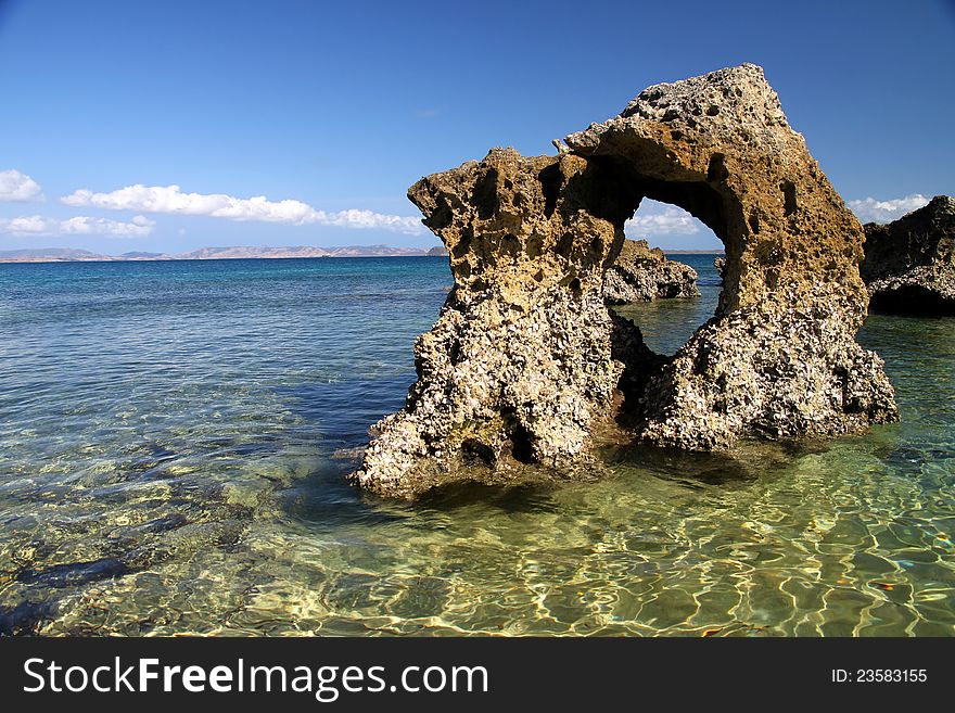 Rocky arch in the sea