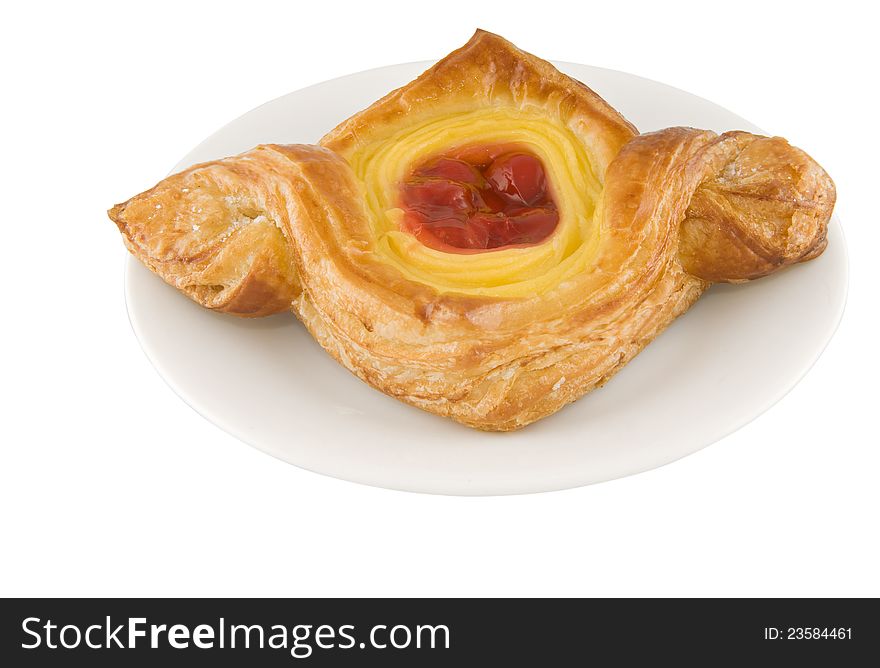 Picture of a red cherry danish pie on a plate