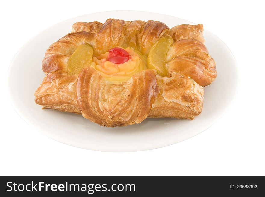 Picture of a Peach danish pie on a plate