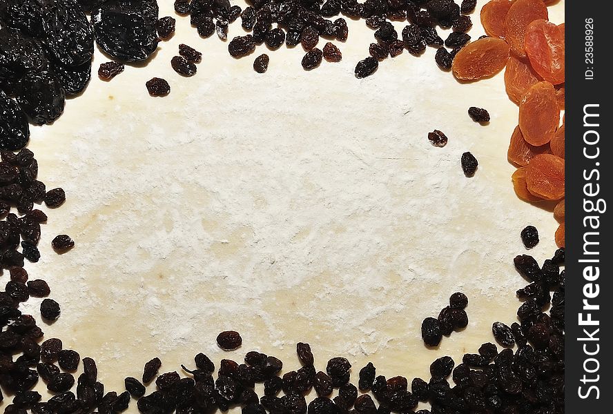 Composion of prunes dried apricots raisins on a dough