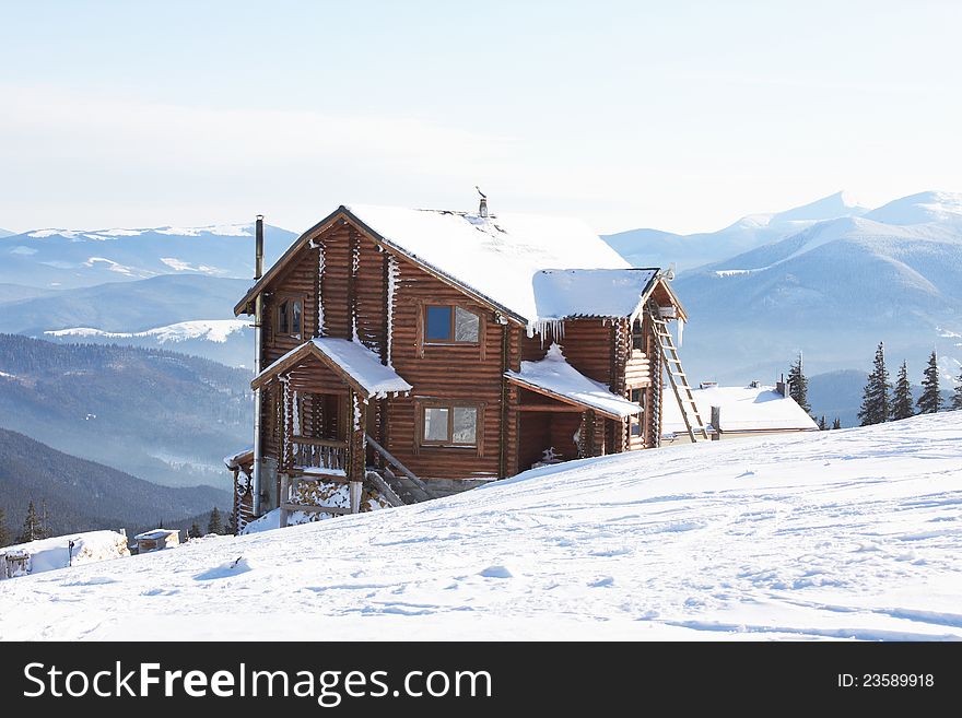 Winter small house Carpathians on a grief