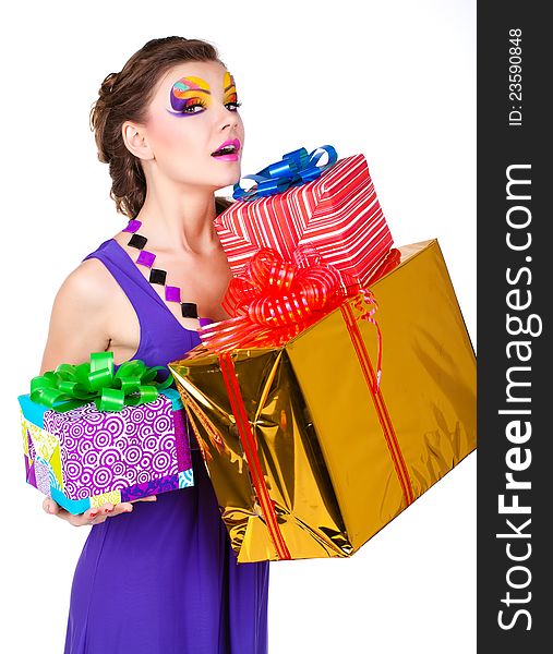 Beautiful woman with make up in dress with gifts