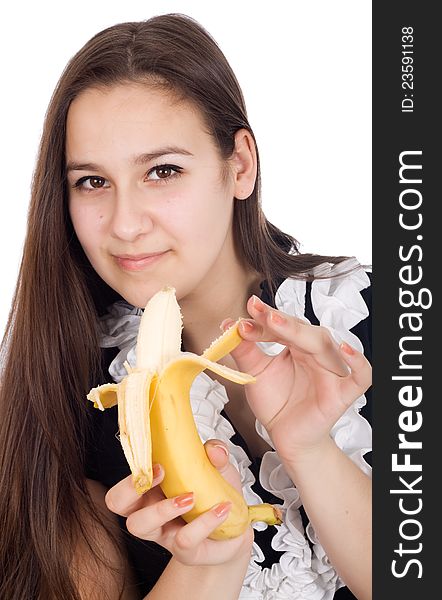 Young beautiful and healthy woman is eating a banana. Young beautiful and healthy woman is eating a banana