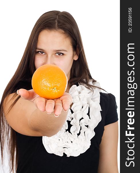Beautiful girl holds out an orange. Beautiful girl holds out an orange