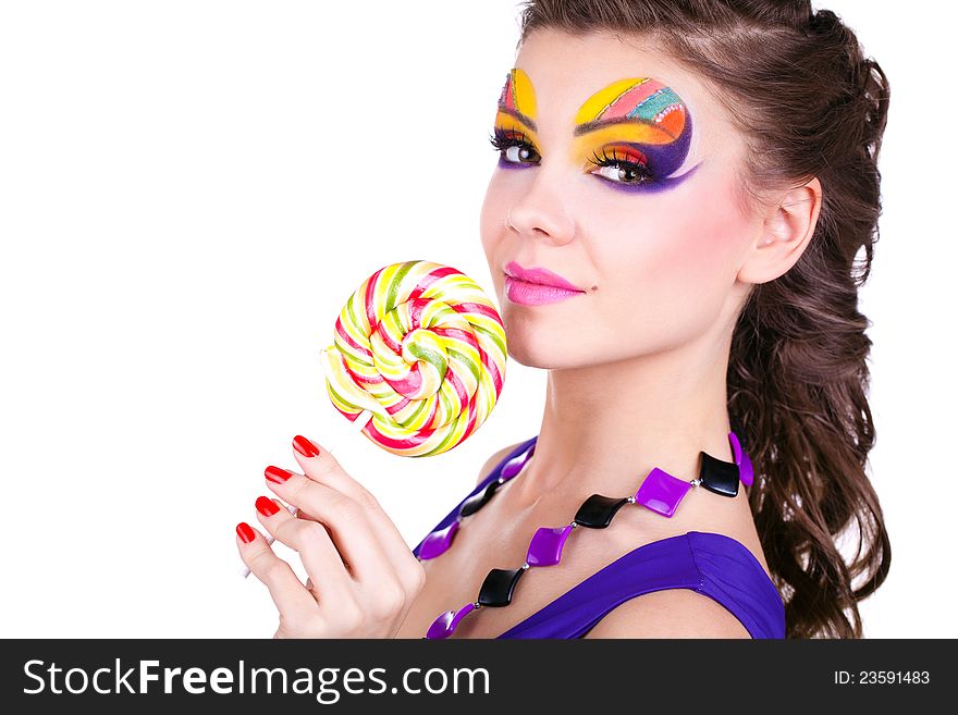 Glamourous beautiful woman holding lollipop