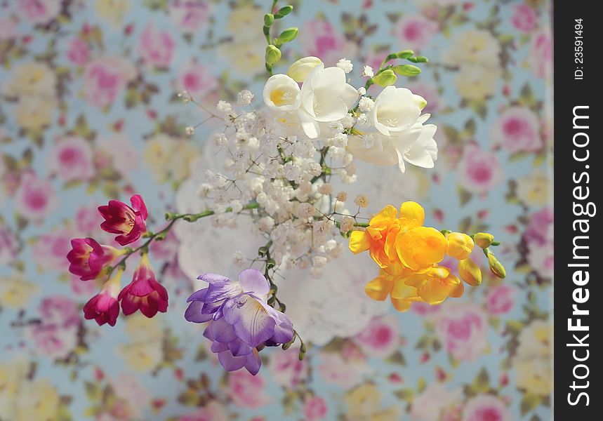 Gentle spring bouquet in a vase on a color cloth. Gentle spring bouquet in a vase on a color cloth