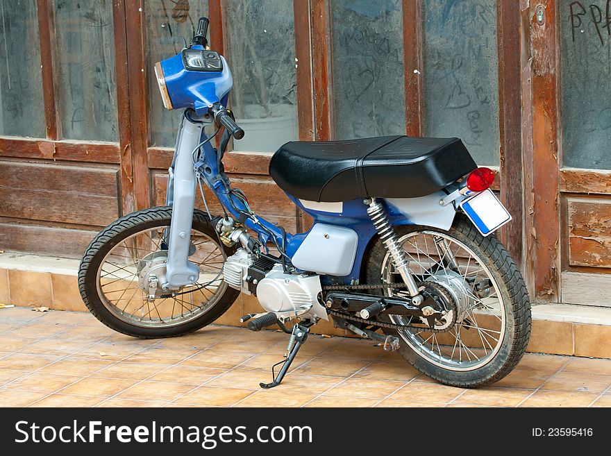 Old motorcycle on the street of Greece