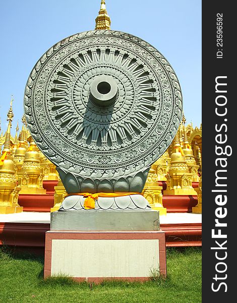 Wheel of Dhamma is symbol of Buddhism at WAT-PA-SAWANG-BUN ,500 pagodas Buddhism temple at Saraburi,Thailand. Wheel of Dhamma is symbol of Buddhism at WAT-PA-SAWANG-BUN ,500 pagodas Buddhism temple at Saraburi,Thailand
