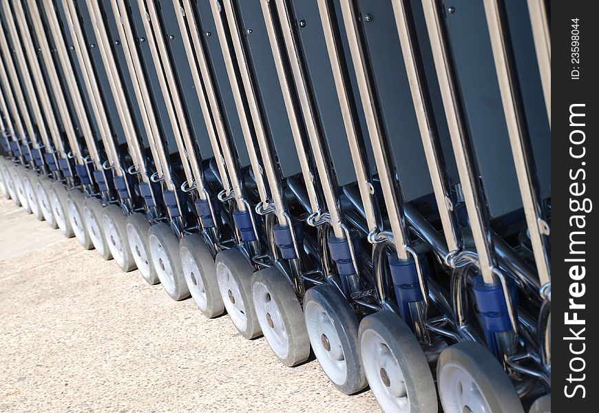 Row of luggage carts wheels