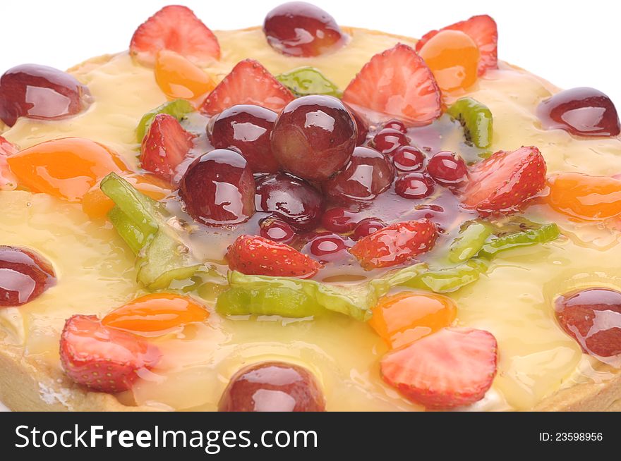 Fruit cake on a plate over white background