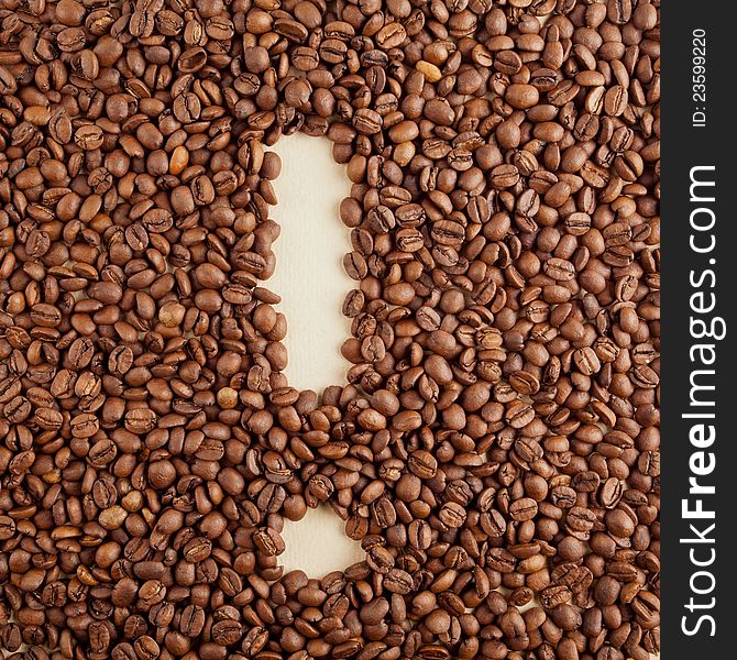 An exclamation mark symbol made from coffee crops on hand-made paper