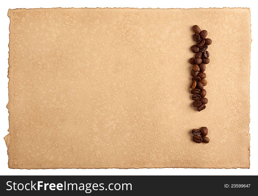 An exclamation mark symbol made from coffee crops on hand-made paper, isolated on white. Place for text. An exclamation mark symbol made from coffee crops on hand-made paper, isolated on white. Place for text.