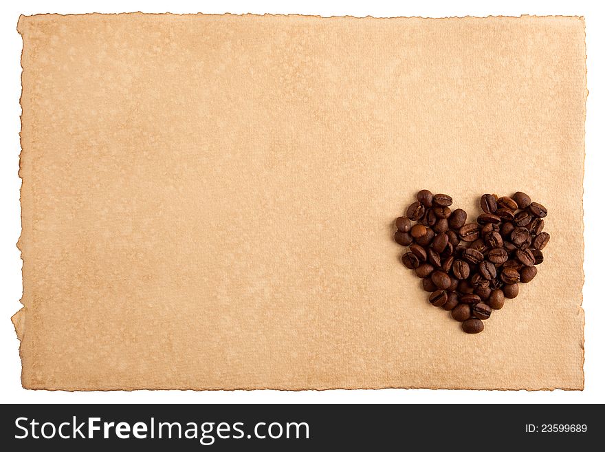 Heart symbol made from coffee crops on hand-made paper and isolated on white. Place for text. Heart symbol made from coffee crops on hand-made paper and isolated on white. Place for text.