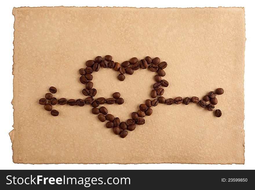 Heart symbol made from coffee crops on hand-made paper and isolated on white. Place for text. Heart symbol made from coffee crops on hand-made paper and isolated on white. Place for text.