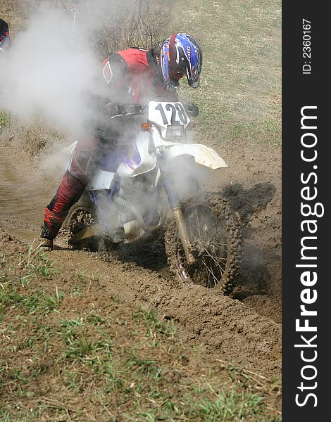 Motorcycle race on a cross-country terrain. Motorcycle race on a cross-country terrain.