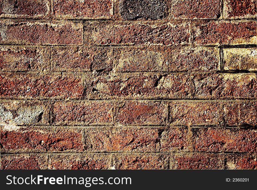 Old damaged weathered brick wall. Old damaged weathered brick wall