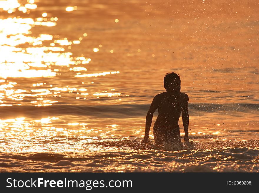 Boy in the at sunset. Boy in the at sunset