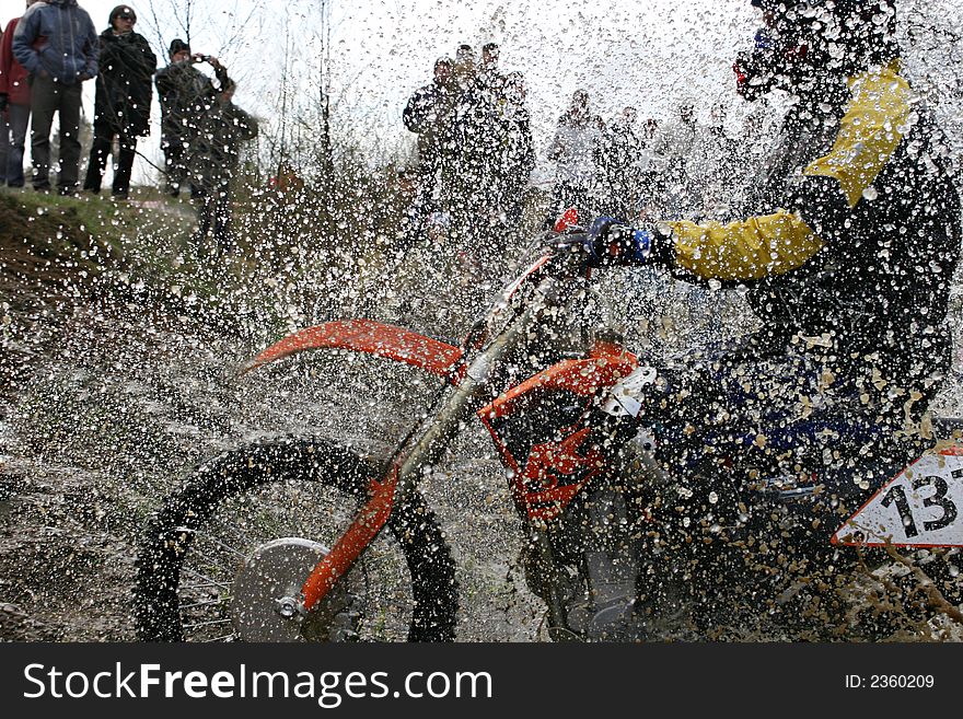 Motorcycle race on a cross-country terrain. Motorcycle race on a cross-country terrain.