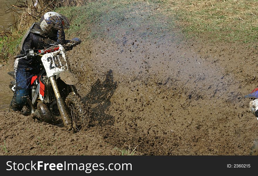 Motorcycle race on a cross-country terrain. Motorcycle race on a cross-country terrain.