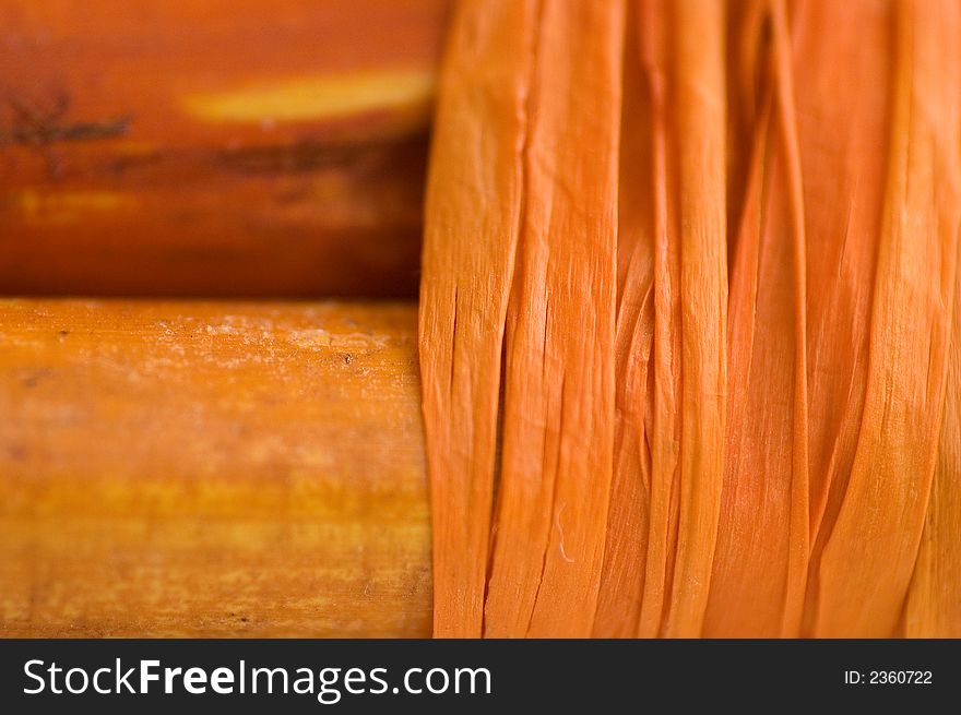 Extreme close-up of canna sticks (bamboo-alike) bundled with raffia. Extreme close-up of canna sticks (bamboo-alike) bundled with raffia