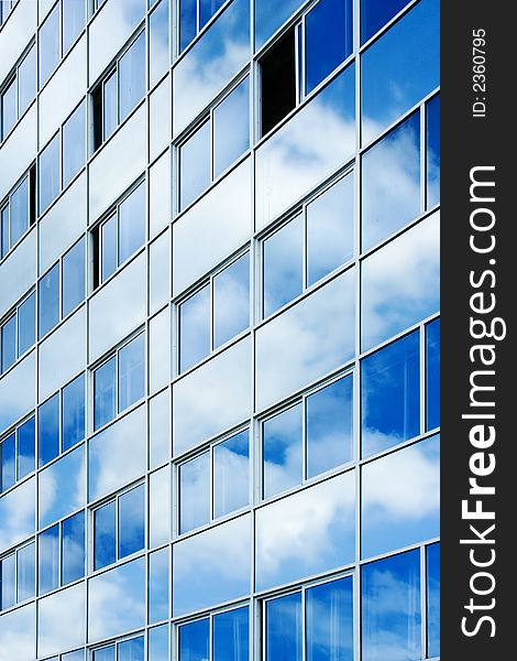 Reflection of clouds on the surface of a wall of an office building. Reflection of clouds on the surface of a wall of an office building