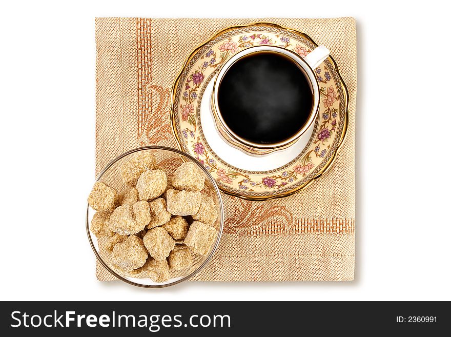 Cup of black coffee and brown sugar elegantly served