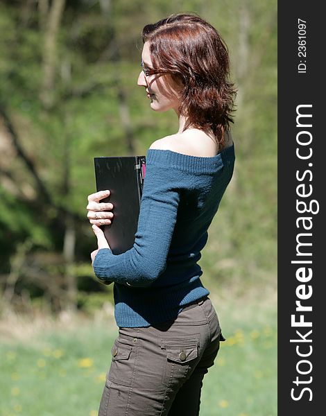 Young Woman And Notebook