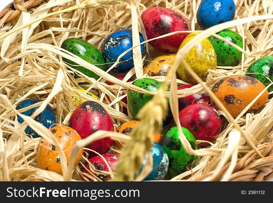 Easter eggs in straw nest. Easter eggs in straw nest