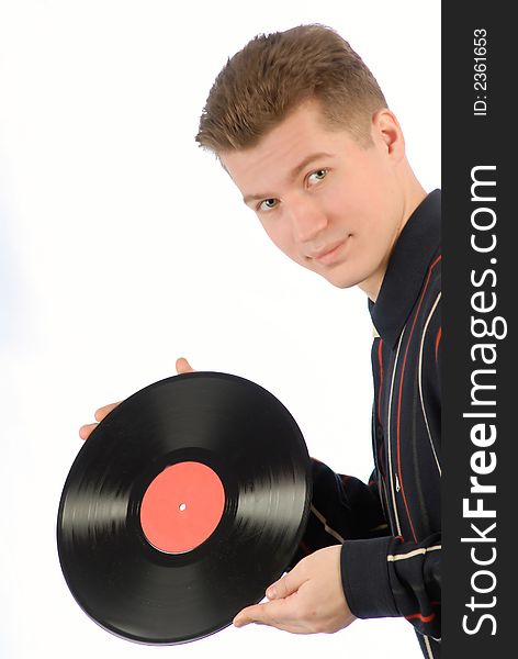 Young guy holds in hands vinyl record on  white background. Young guy holds in hands vinyl record on  white background