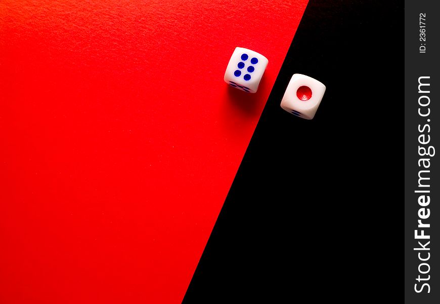 Two dices; red 1 on black background and blue 6 on red background. Two dices; red 1 on black background and blue 6 on red background