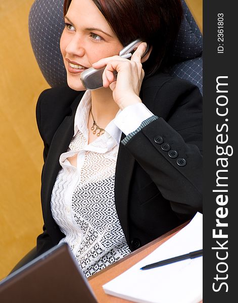 Cute business woman on the phone chatting. Cute business woman on the phone chatting